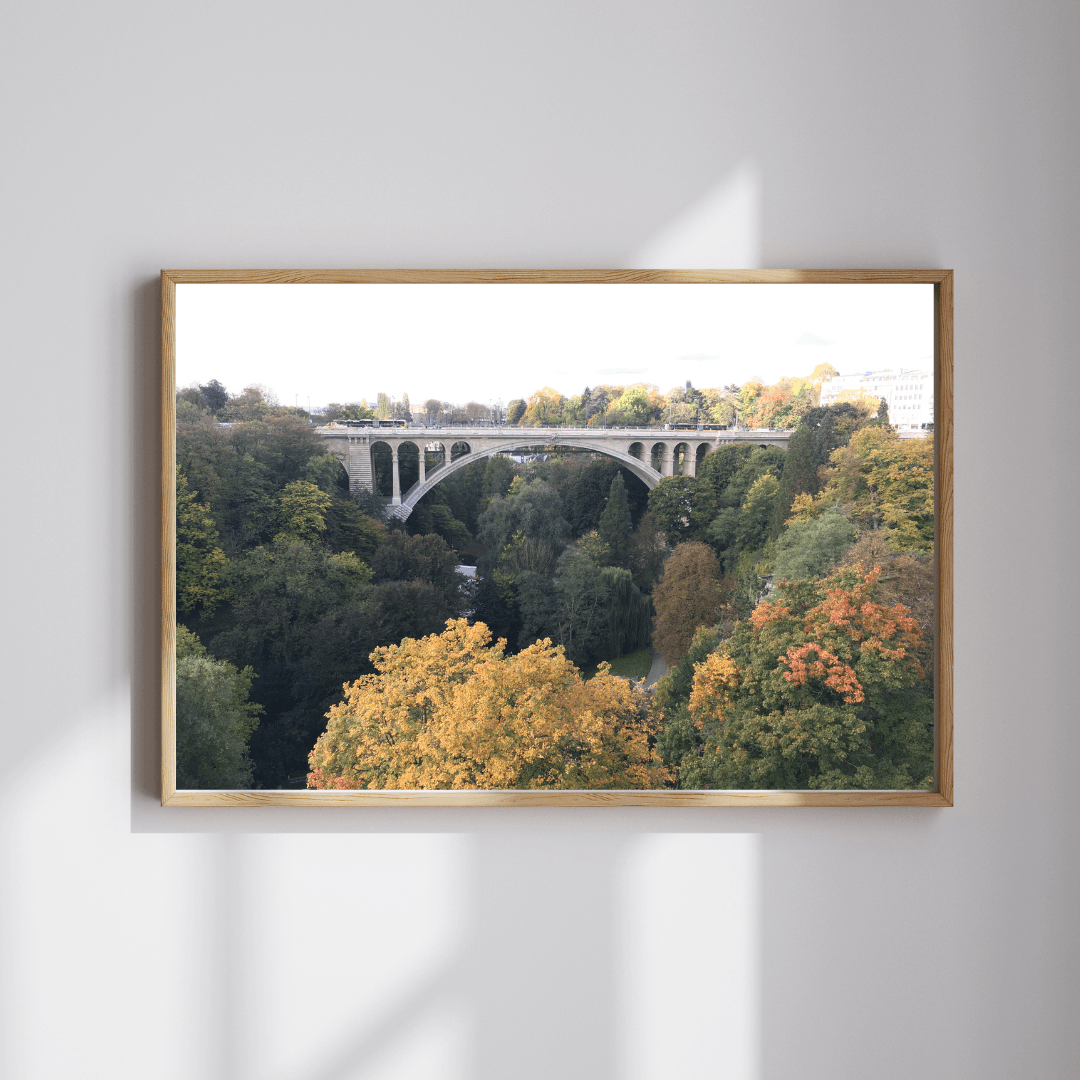 Adolphe Bridge fine art travel photography print featuring Luxembourg's Adolphe Bridge in autumn with the red, yellow and green foliage