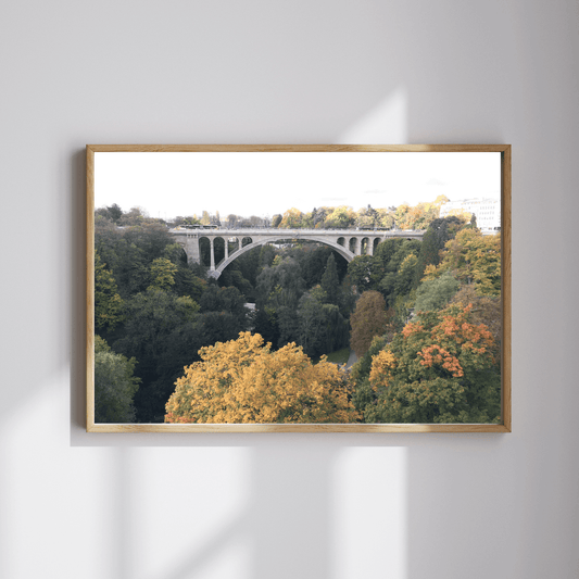 Adolphe Bridge fine art travel photography print featuring Luxembourg's Adolphe Bridge in autumn with the red, yellow and green foliage