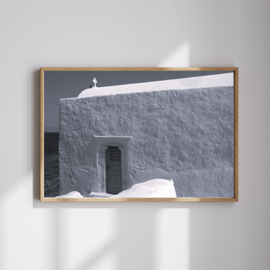 Grace on Stone fine art travel photography black and white print featuring a small cross on top of a whitewashed building in Mykonos, Greece