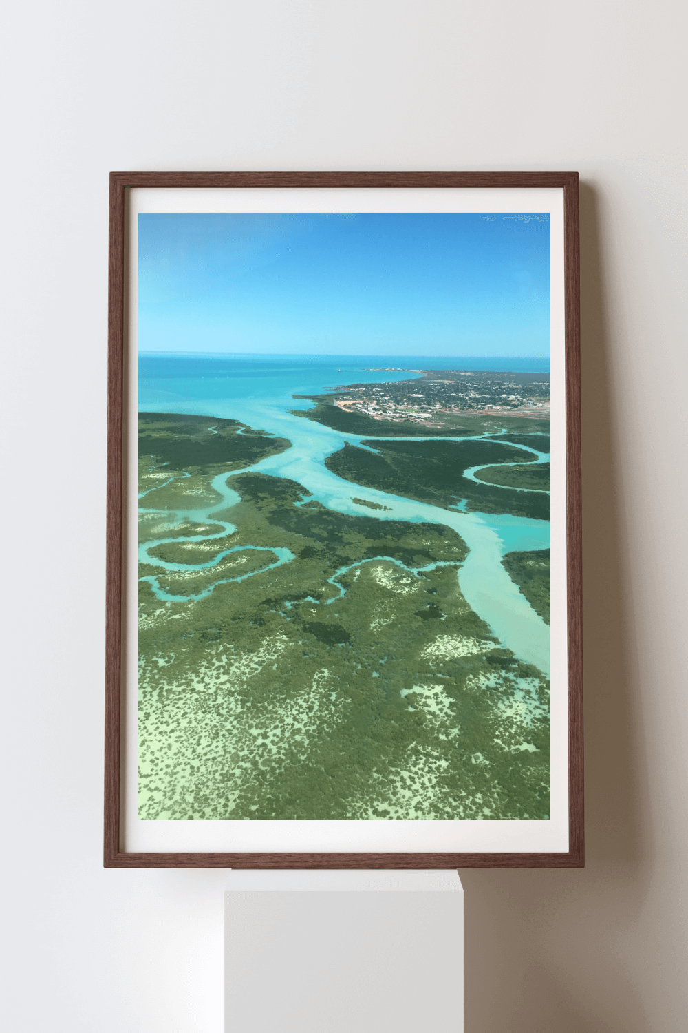 Lush Blue fine art travel photography print featuring an aerial view of the winding crystal blue waterways of the ocean through the green bushland in Australia