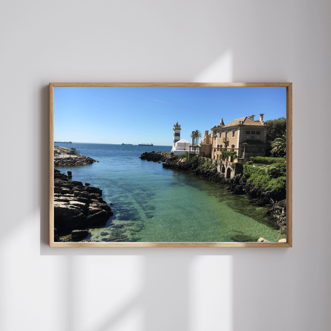 The Lighthouse fine art travel photography print featuring the Santa Maria lighthouse next to the ocean-side villa in Cascais, Portugal