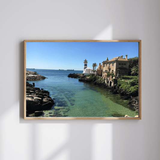 The Lighthouse fine art travel photography print featuring the Santa Maria lighthouse next to the ocean-side villa in Cascais, Portugal
