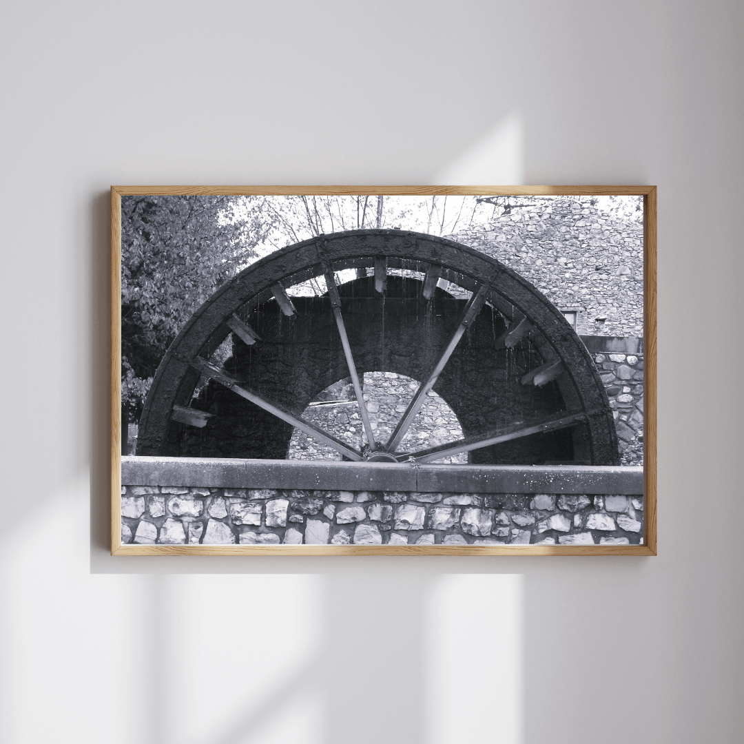 Turning through Time fine art travel photography black and white print featuring a water wheel in a regional small village in Provence, the south of France