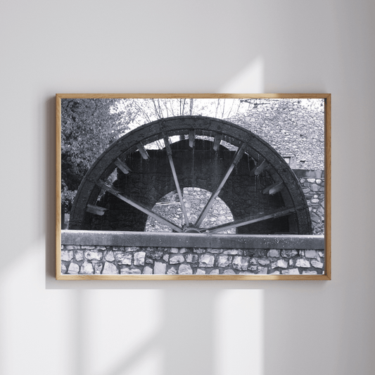 Turning through Time fine art travel photography black and white print featuring a water wheel in a regional small village in Provence, the south of France